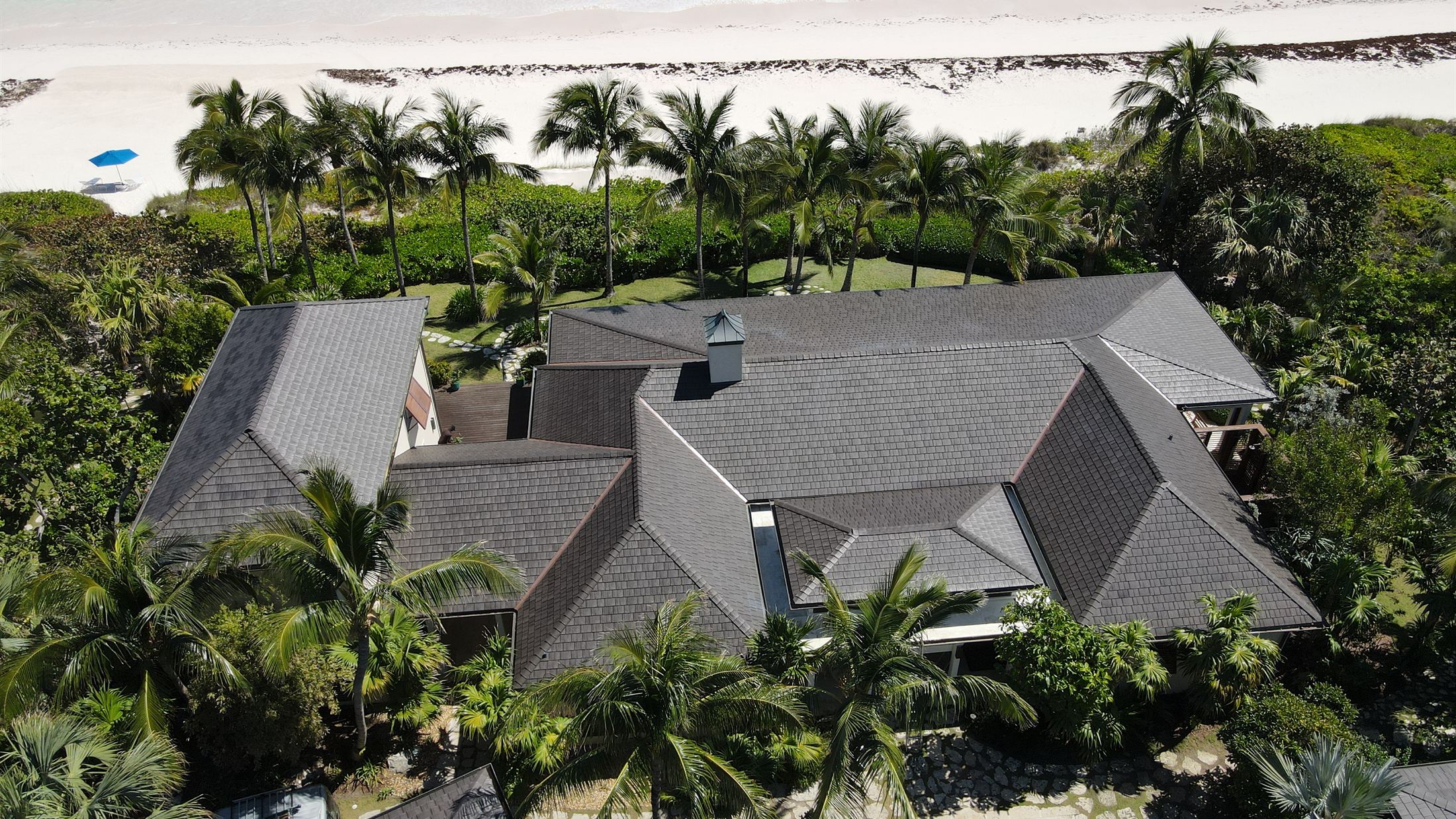 New Enviroshake roof on a Harbour Island home with the beach behind